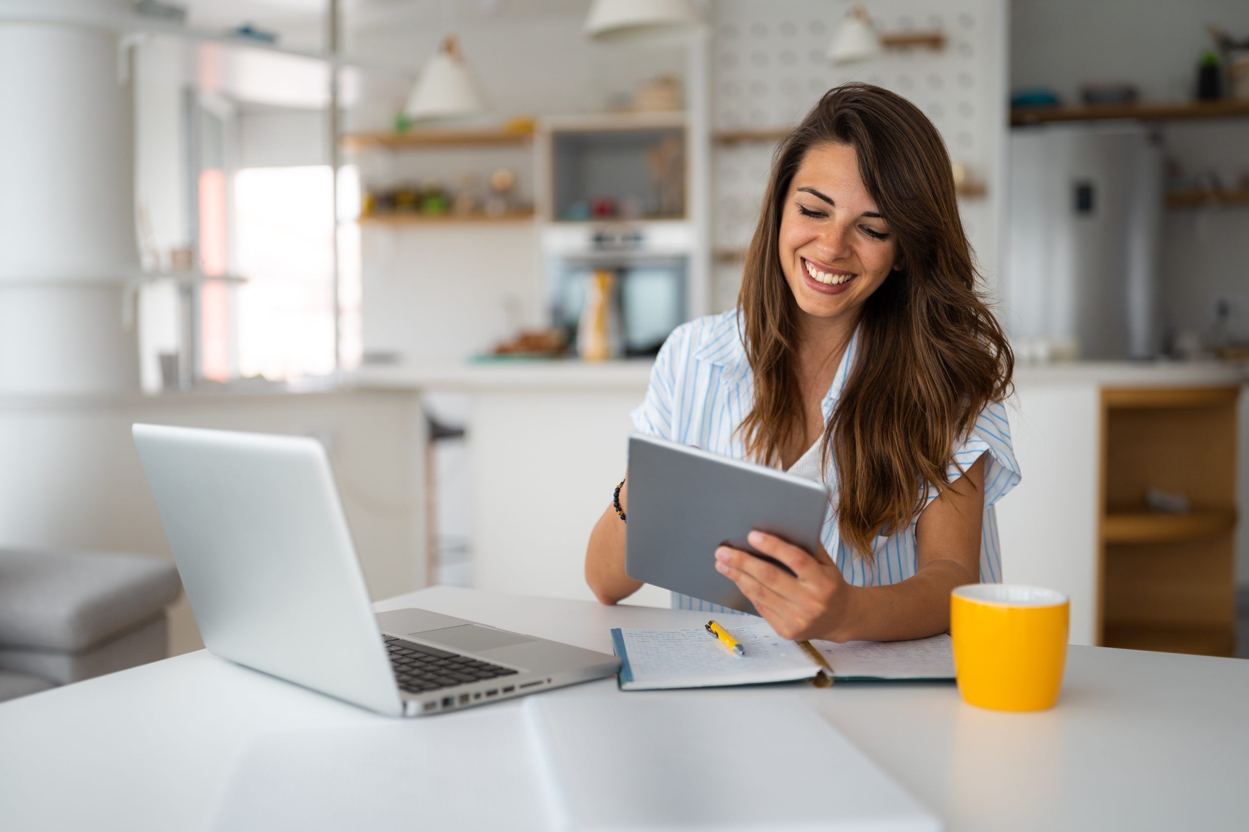 Woman Using Digital Tablet And laptop