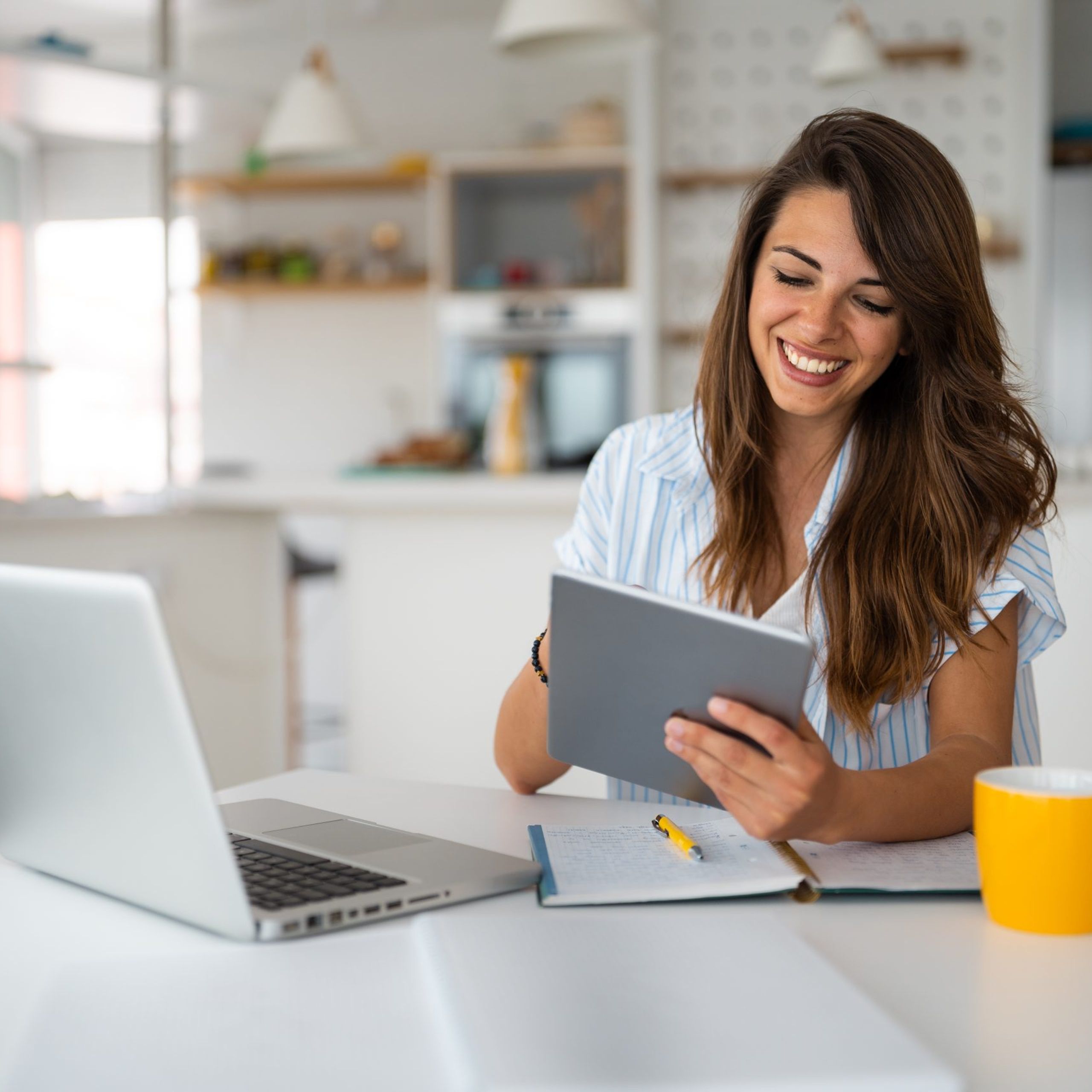 Woman Using Digital Tablet And laptop